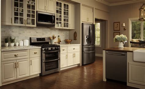 cream colored kitchen cabinets with black stainless steel appliances|black stainless steel cabinet color schemes.